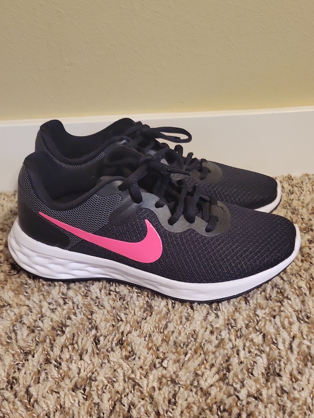 Nike Women's Black Running Shoes with Pink Swoosh